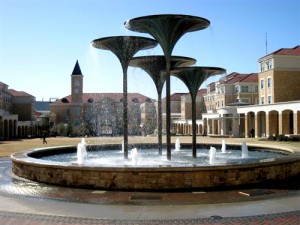 Scharbauer Hall and Residence Halls in Campus Commons with Frog Fountain in foreground at Texas Christian University